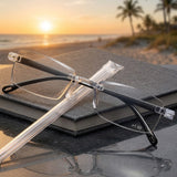 Reading glasses with anti-blue light lenses resting on an open book
